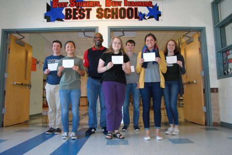 Eight seniors stand with their Letters of Commendation. Students selected for this do not continue in the NMS competition.