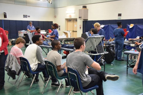 From left to right: Caleb Story, Jordan Tensley, Dante Parks, and Darren Acosta wait to get their blood taken. 