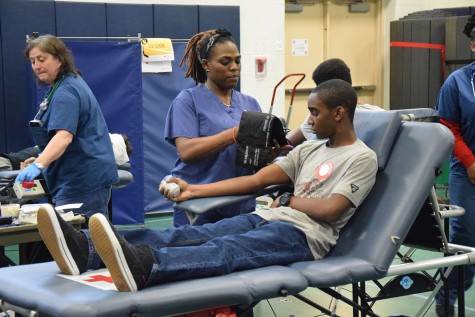 Dante Parks checks his blood pressure. 