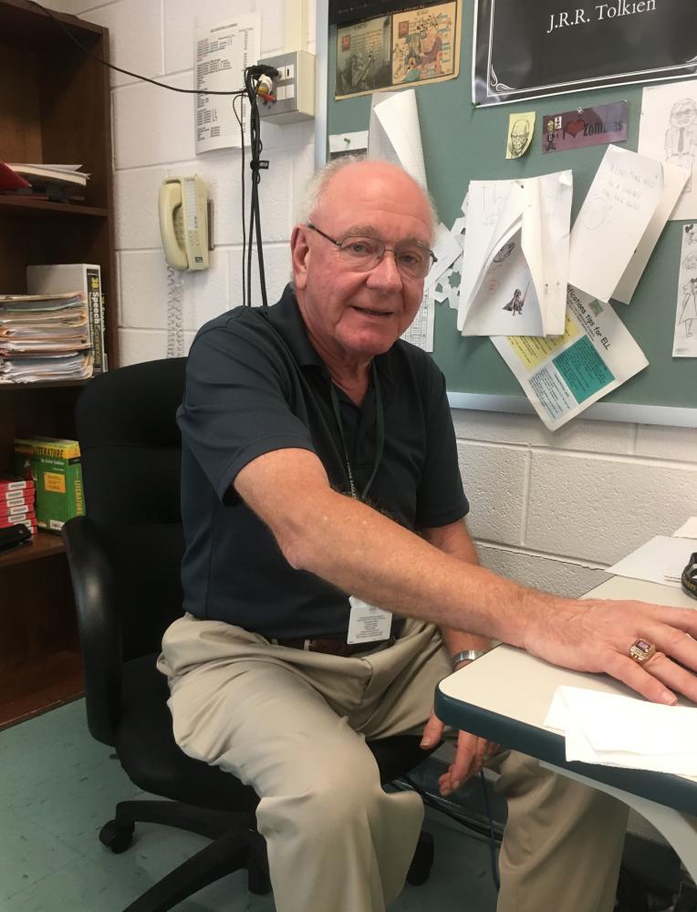 Kopcak sitting at his desk, after a wonderful day of teaching.