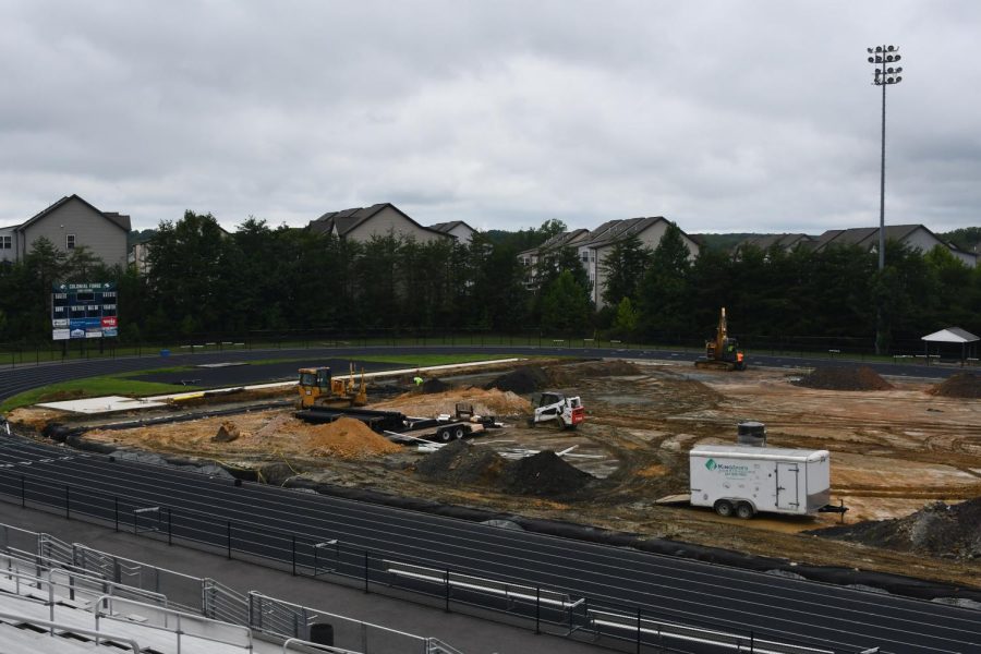 On August 22, the turf field remains a pile of mud as construction crews build the base layer for the new turf. 