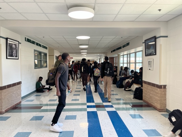 Students crowd the library hallway, a common sight during power hour.