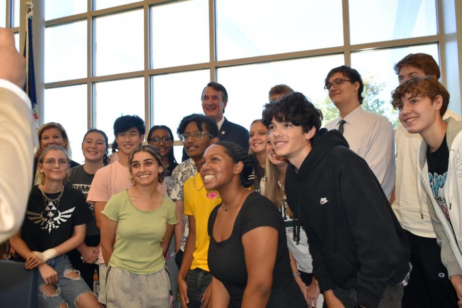 Students in Mr. Thomas Coens government class pose with the governor at the close of the events. 