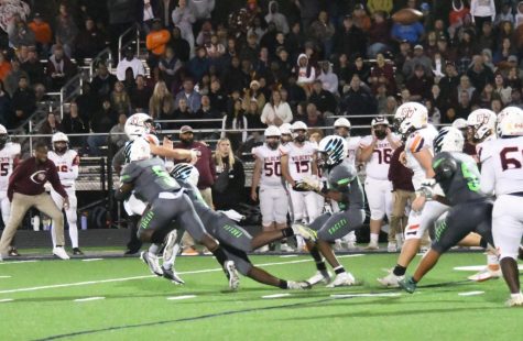 Two Forge defensive players put pressure on the Mountain View quarterback and take him down to force an incompletion.