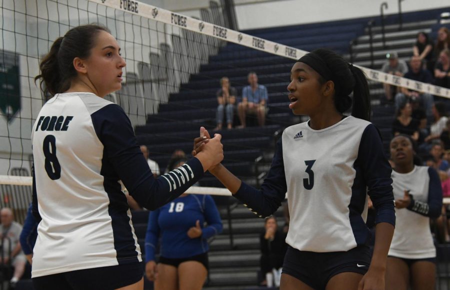 Kyla Saunders (24) and Leah Doty (23) support each other on the court. just keep everyones energy up because if one persons down, you cant really motivate the team because that one persons energy is going to bring everyones motivation down and you cant really get we need done done. Kyla said. 