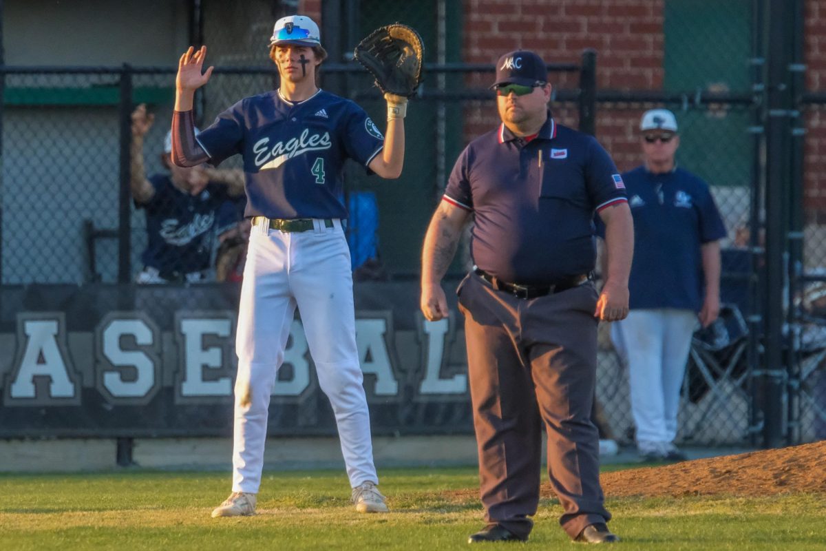 Cameron Biller (24) on the mound ready to receive a throw.